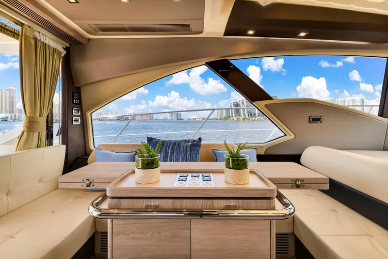 Slide: The Image of Interior of 2016 Azimut 55S yacht with elegant seating and scenic ocean view. - 26