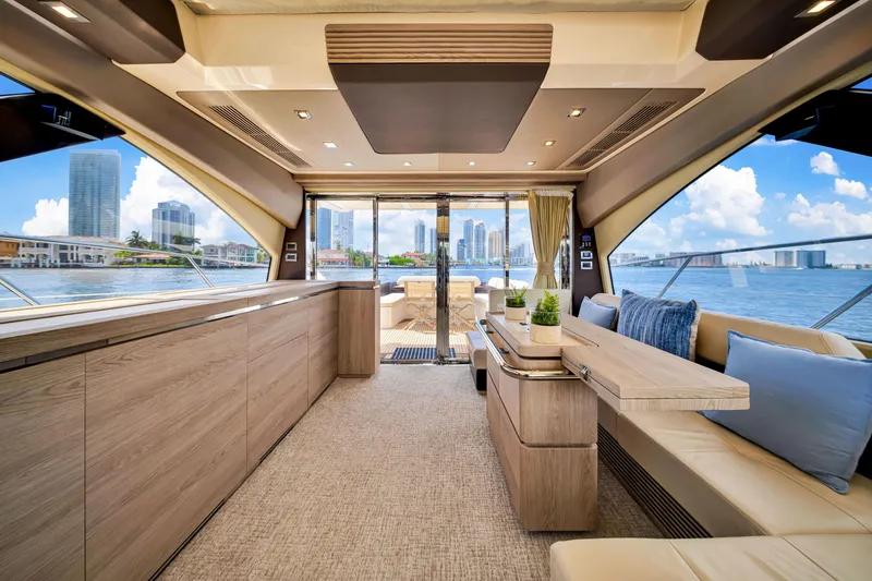 Slide: The Image of Luxurious interior of a 2016 Azimut 55S yacht with modern furnishings and city skyline view. - 30