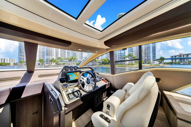 Slide: The Image of Luxurious 2016 Azimut 55S yacht interior with modern helm and panoramic windows. - 40