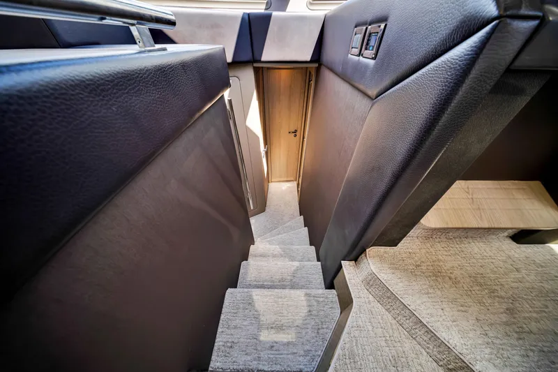 Slide: The Image of Interior stairs of 2016 Azimut 55S yacht, featuring sleek design and modern materials. - 42