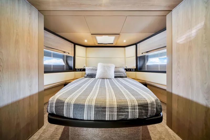 Slide: The Image of Luxurious bedroom interior of 2016 Azimut 55S yacht with modern design and striped bedding. - 47