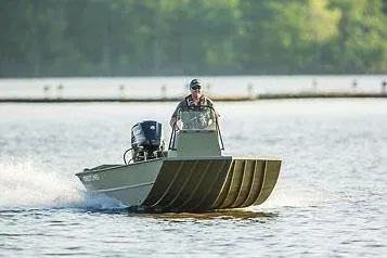Slide: The Image of Manufacturer Provided Image: 2026 Crestliner 1660 Retriever FCC boat cruising on a lake with a driver. - 13