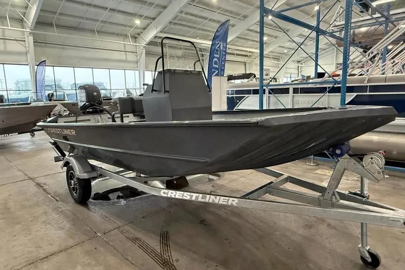 Slide: The Image of 2026 Crestliner 1660 Retriever FCC boat on trailer in showroom. - 2