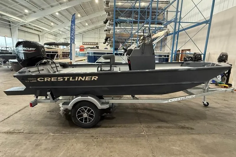 Slide: The Image of 2026 Crestliner 1660 Retriever FCC boat on trailer in showroom. - 3