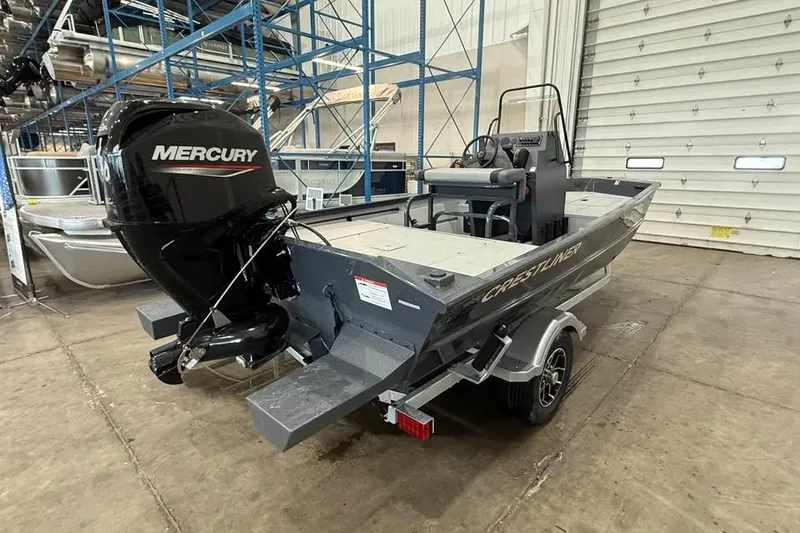 Slide: The Image of 2026 Crestliner 1660 Retriever FCC boat with Mercury engine in warehouse setting. - 5
