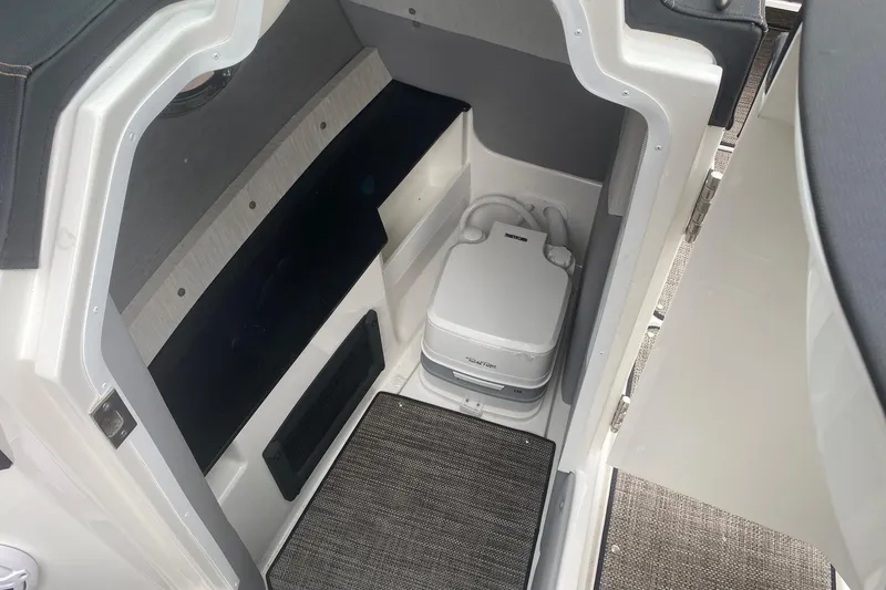 Slide: The Image of 2022 Cobalt R8 boat interior with compact marine toilet. - 10