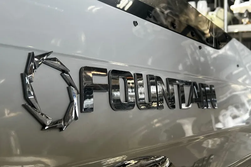 Slide: The Image of Close-up of 2009 Fountain 42 Executioner boat logo in chrome finish. - 14