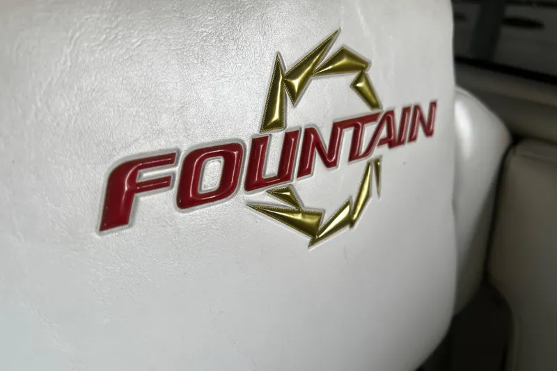Slide: The Image of Fountain 42 Executioner 2009 logo on white leather seat. - 21