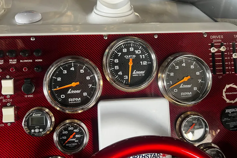Slide: The Image of Dashboard of a 2009 Fountain 42 Executioner boat with Livorsi gauges and controls. - 25