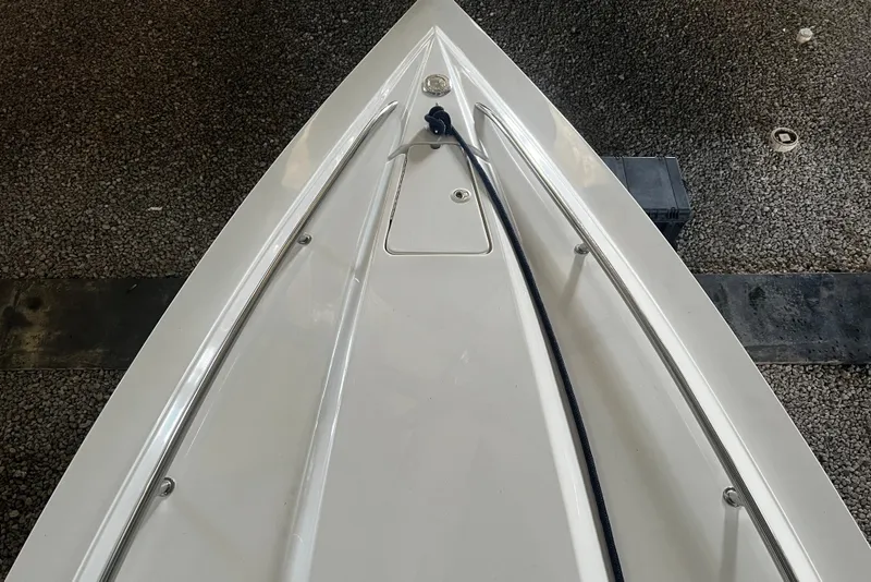 Slide: The Image of Bow of 2009 Fountain 42 Executioner boat on gravel surface. - 32