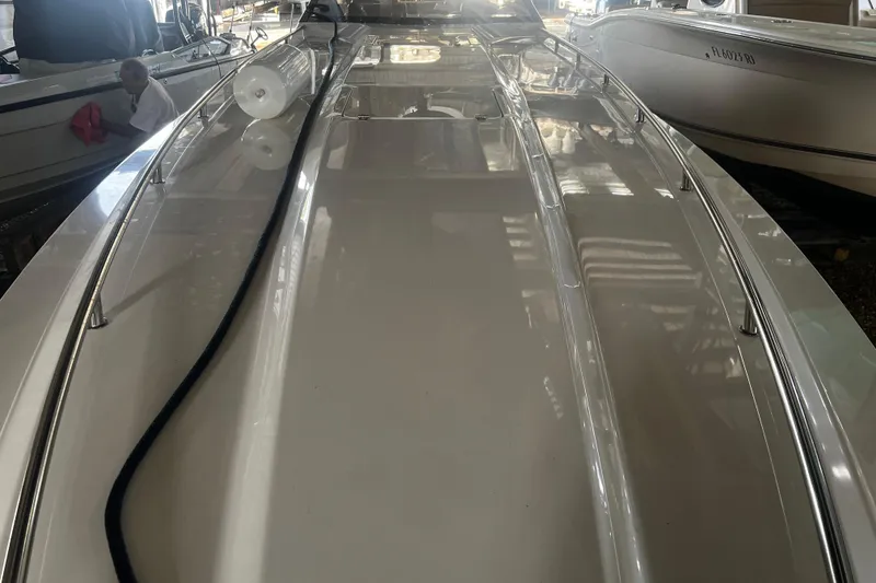 Slide: The Image of 2009 Fountain 42 Executioner boat deck in a marina setting. - 34