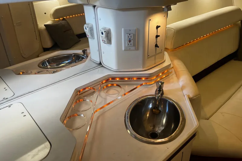 Slide: The Image of 2009 Fountain 42 Executioner interior with sink, cup holders, and ambient lighting. - 39