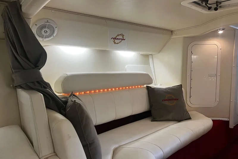 Slide: The Image of Interior of 2009 Fountain 42 Executioner boat with white seating and branded cushions. - 52