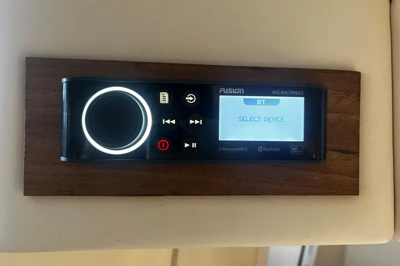 Slide: The Image of Fusion MS-RA70NSX stereo system on 2009 Fountain 42 Executioner boat, displaying "Select Device." - 57