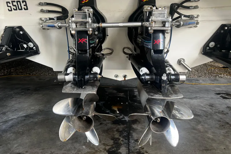 Slide: The Image of 2009 Fountain 42 Executioner boat with dual propeller drives in a garage setting. - 6