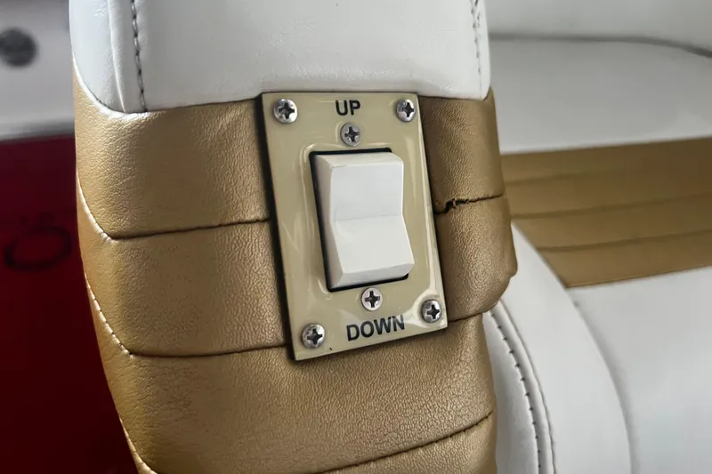 Slide: The Image of Switch on gold and white leather seat, Fountain 42 Executioner 2009 boat. - 62