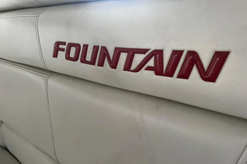 Slide: The Image of Fountain 42 Executioner 2009 boat interior with red logo on white upholstery. - 65