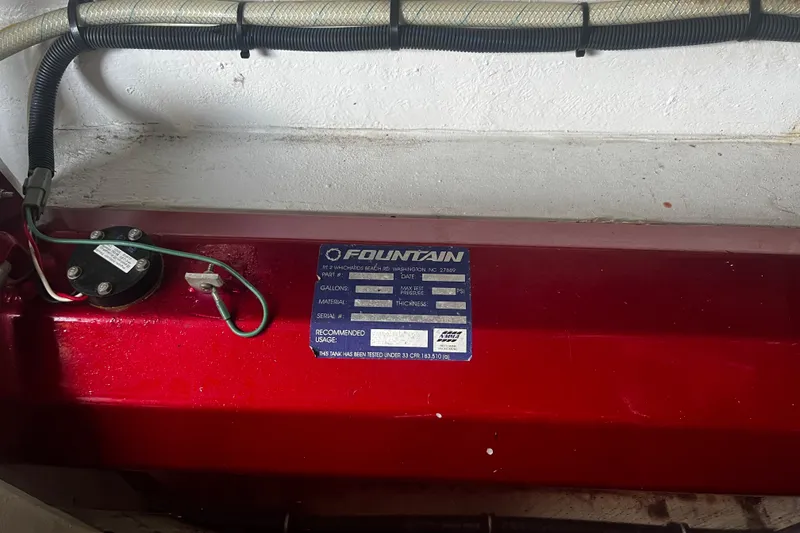 Slide: The Image of 2009 Fountain 42 Executioner label on red surface, showing specifications and wiring. - 74