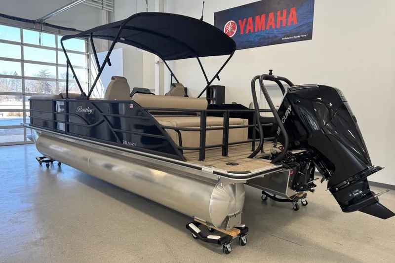 Slide: The Image of 2026 Bentley Pontoons Legacy 243 Swingback in showroom, featuring sleek design and powerful engine. - 2