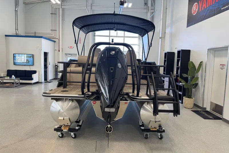 Slide: The Image of 2026 Bentley Pontoons Legacy 243 Swingback displayed in a showroom, featuring sleek design and modern amenities. - 4