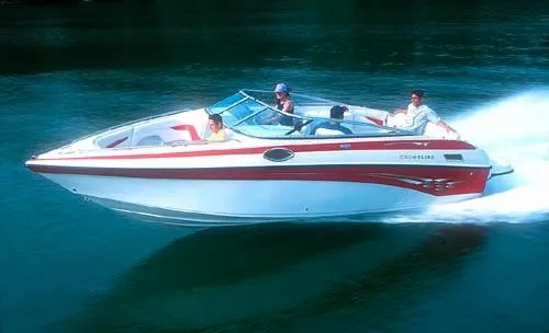 The Image of 2002 Crownline 230 BR boat in a garage, elevated on blocks. - 0