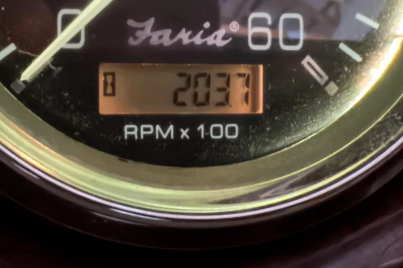 Slide: The Image of Close-up of a Faria tachometer showing 2037 RPM on a 2002 Crownline 230 BR boat. - 12