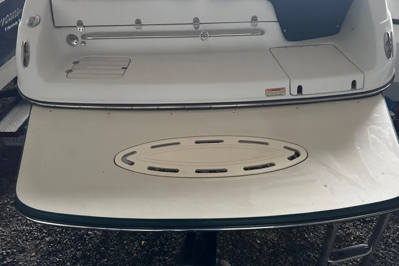 Slide: The Image of 2002 Crownline 230 BR boat swim platform with ladder and storage compartments. - 4