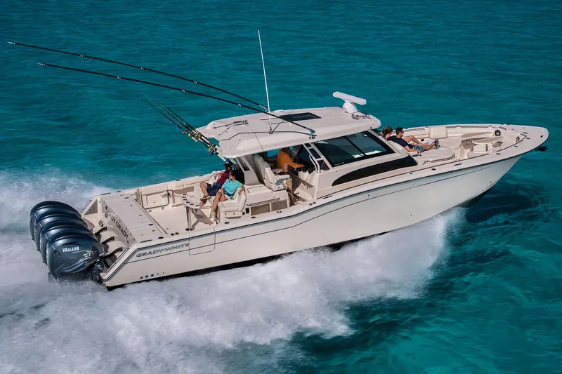 The Image of 2022 Grady-White Canyon 456 boat docked near Miami Boat Show, surrounded by tropical scenery. - 0