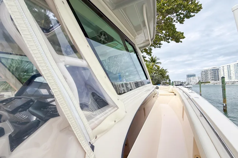 Slide: The Image of 2022 Grady-White Canyon 456 helm with advanced navigation displays and controls. - 22