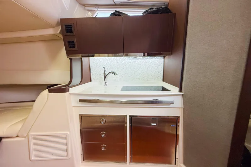 Slide: The Image of Luxurious interior of 2022 Grady-White Canyon 456 boat with modern kitchen and seating. - 30