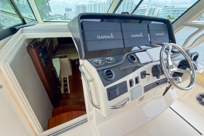 Slide: The Image of 2022 Grady-White Canyon 456 boat interior with modern kitchenette and storage. - 32