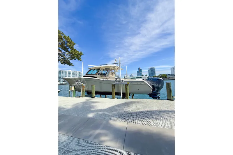 Slide: The Image of Luxurious interior of 2022 Grady-White Canyon 456 boat with modern kitchen and seating. - 33