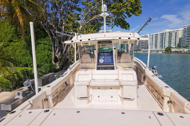 Slide: The Image of Open storage compartments on a 2022 Grady-White Canyon 456 boat deck. - 42