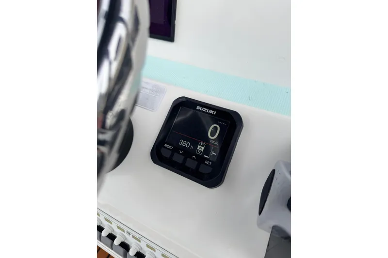 Slide: The Image of Close-up of a Suzuki digital display on a 2017 Shallow Sport 24 Sport boat. - 13