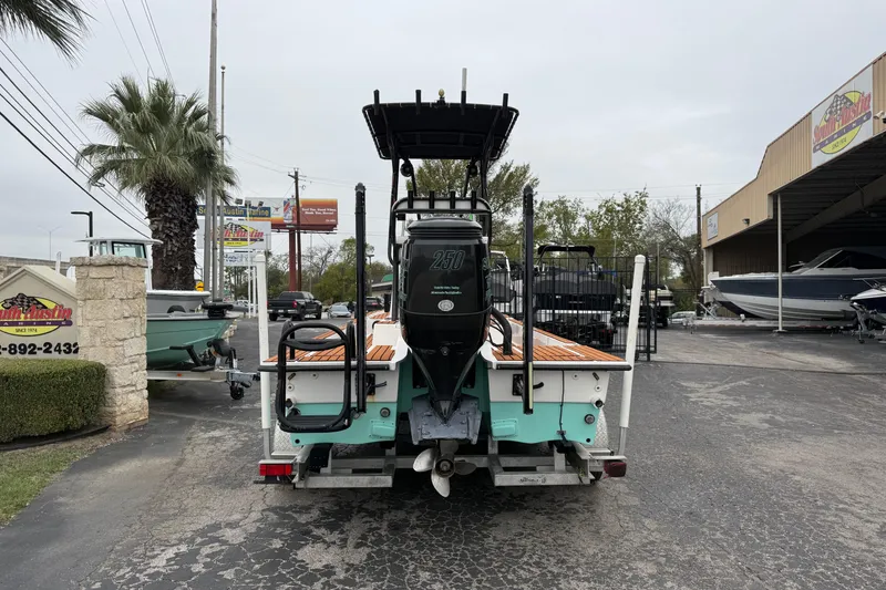 Slide: The Image of 2017 Shallow Sport 24 Sport boat on trailer at dealership, rear view. - 2