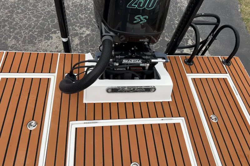 Slide: The Image of 2017 Shallow Sport 24 Sport boat deck with Seastar hydraulic steering system. - 25