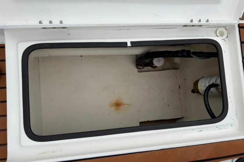 Slide: The Image of Open storage compartment in 2017 Shallow Sport 24 Sport boat. - 27