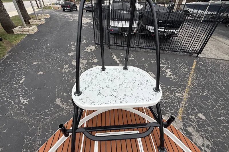 Slide: The Image of 2017 Shallow Sport 24 Sport boat with elevated platform and black railing. - 34