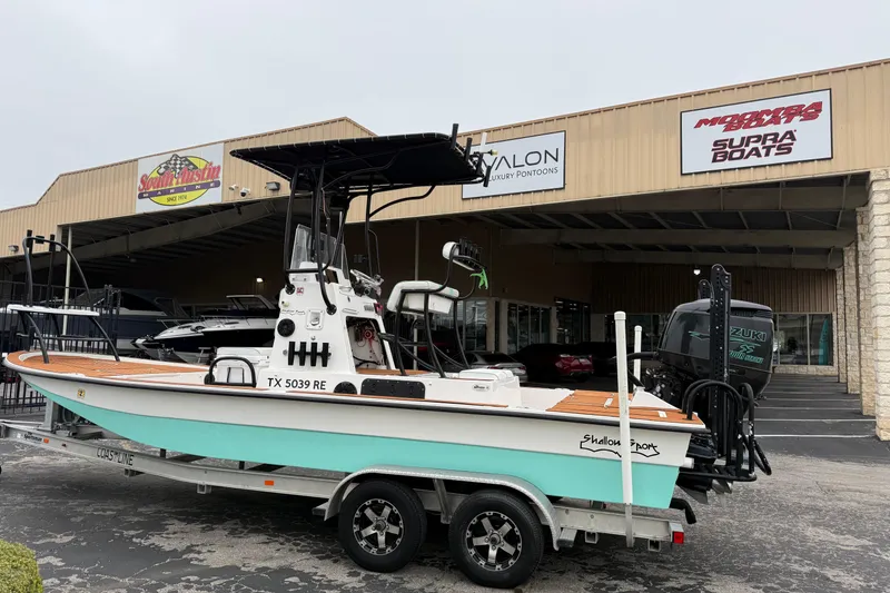 Slide: The Image of 2017 Shallow Sport 24 Sport boat on trailer outside dealership. - 4