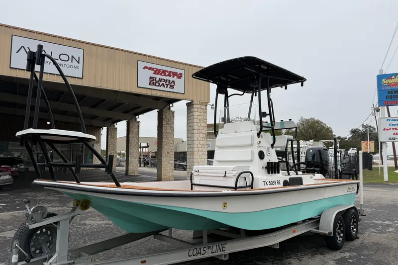 Slide: The Image of 2017 Shallow Sport 24 Sport boat on trailer, parked outside dealership. - 5