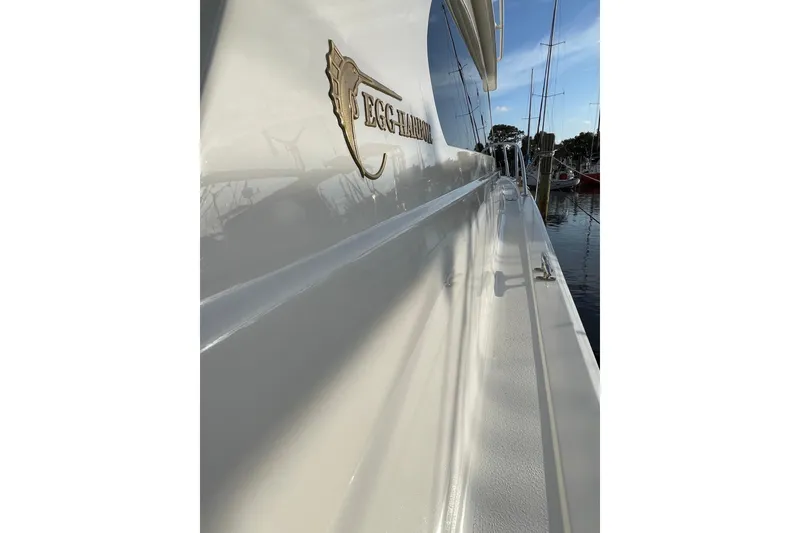 Slide: The Image of Side view of a 2003 Egg Harbor 37 Sport Fisher boat docked at a marina. - 22