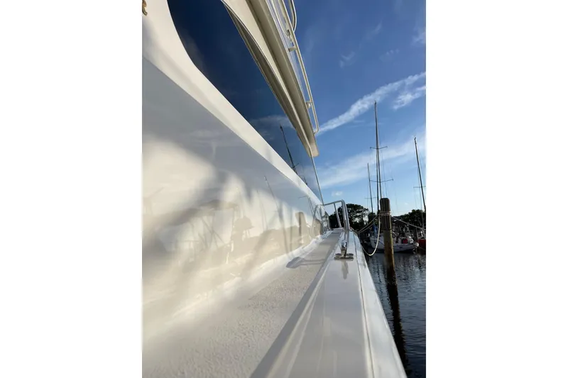 Slide: The Image of Side view of a 2003 Egg Harbor 37 Sport Fisher yacht docked at a marina. - 24