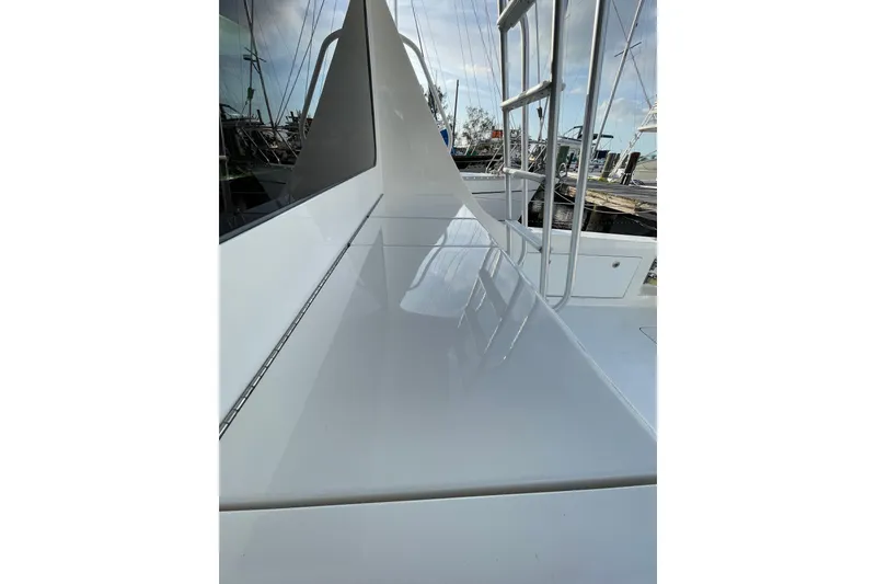 Slide: The Image of 2003 Egg Harbor 37 Sport Fisher yacht deck with sleek, polished surface and railing. - 29