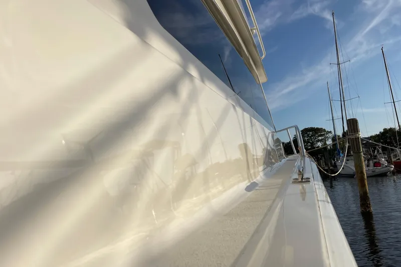 Slide: The Image of Side view of a 2003 Egg Harbor 37 Sport Fisher yacht docked at a marina. - 36