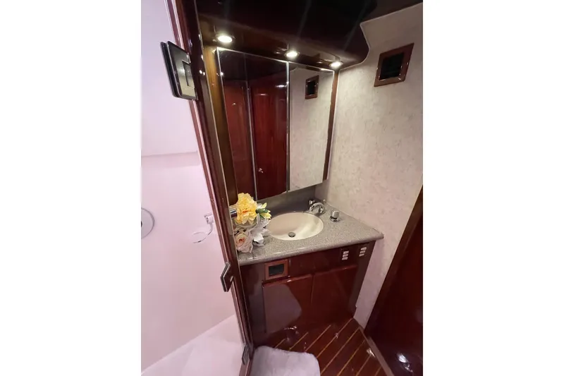 Slide: The Image of Luxurious bathroom interior of 2003 Egg Harbor 37 Sport Fisher yacht with elegant wood finishes. - 46