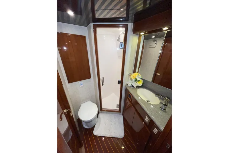 Slide: The Image of Luxurious bathroom in 2003 Egg Harbor 37 Sport Fisher yacht with shower and vanity. - 47