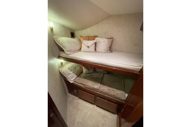 Slide: The Image of 2003 Egg Harbor 37 Sport Fisher cabin with cozy bunk beds and elegant decor. - 50