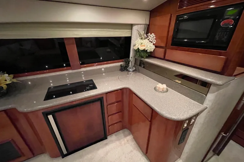 Slide: The Image of Luxurious kitchen interior of 2003 Egg Harbor 37 Sport Fisher yacht with modern appliances. - 57