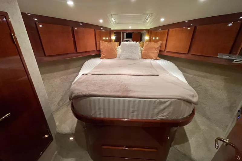 Slide: The Image of Luxurious cabin interior of 2003 Egg Harbor 37 Sport Fisher yacht with cozy bedding. - 62