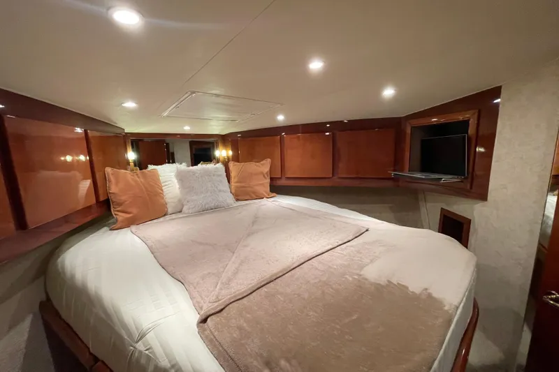 Slide: The Image of Luxurious bedroom interior of 2003 Egg Harbor 37 Sport Fisher yacht with cozy bedding. - 63